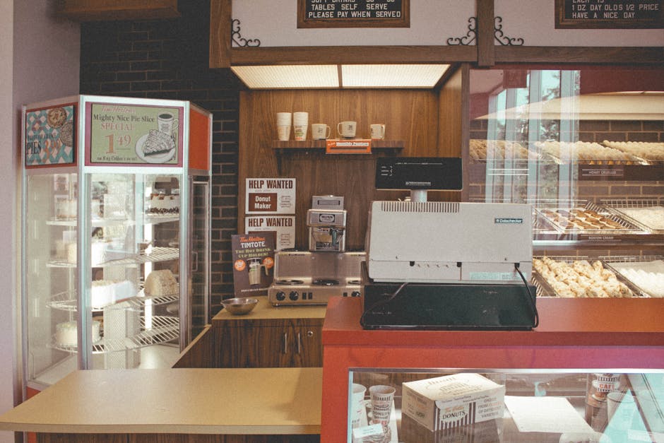 Cozy bakery interior showcasing pastries, pies, and a vintage cash register for a nostalgic vibe.