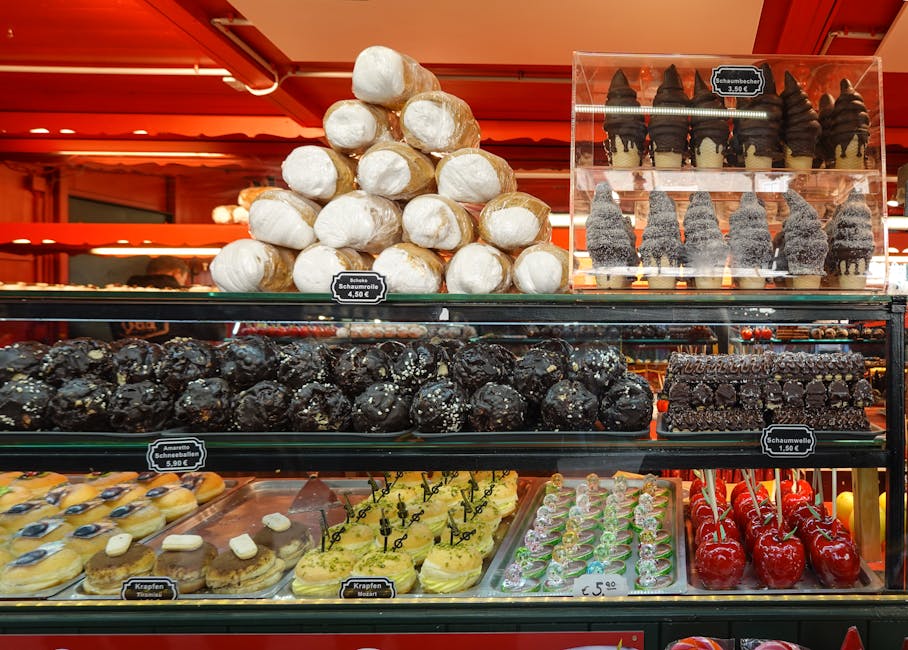 Delicious assortment of pastries and sweets on display in a vibrant bakery. Perfect temptation for dessert lovers.
